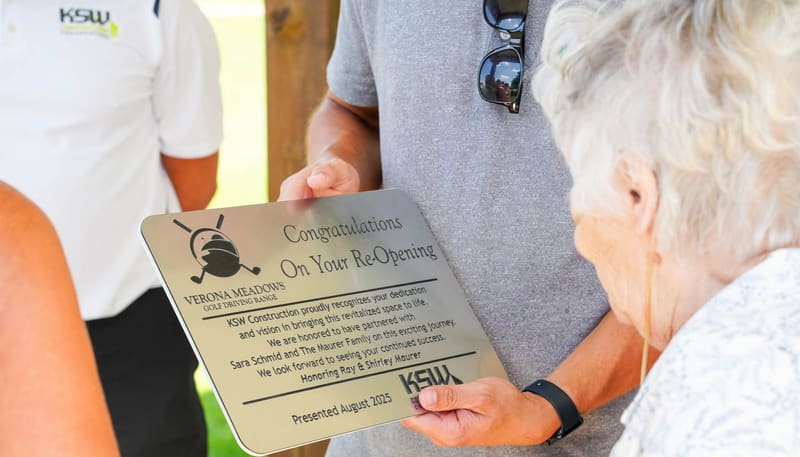 A commemorative plaque from KSW Construction congratulating Verona Meadows on its reopening and honoring Ray and Shirley Maurer